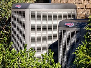 Residential Air Conditioning Installation Services Lennox HVAC units installed outside a brick home in North Texas