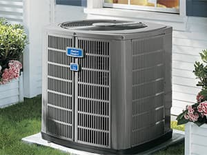 Air Conditioning System Installation in North East Tarrant County American Standard AC unit outside a residential home in the Mid-Cities of North Texas