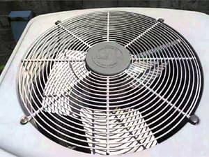 Understanding Air Conditioning Systems Top view of an outdoor air conditioning unit fan and grille
