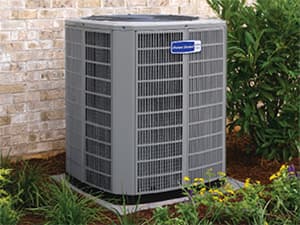 Professional AC Repair Service Servicing an American Standard air conditioning unit