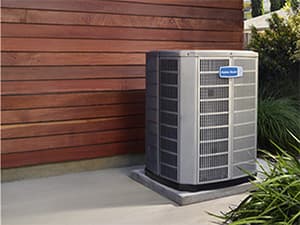 Heat Pump Repair and Maintenance HVAC technician servicing a residential heat pump system