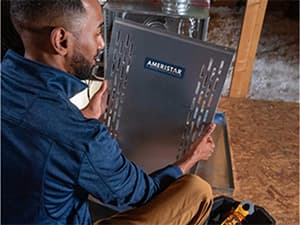 Heat Pump Repair and Maintenance HVAC technician servicing a residential heat pump system