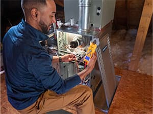 Professional Air Conditioning and Heating System Diagnostics Mid-Cities HVAC technician diagnosing an air conditioning system issue