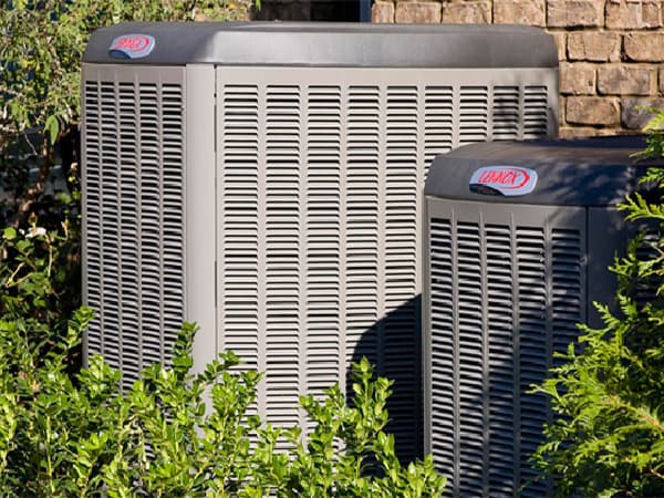 Residential Air Conditioning Installation Services Lennox HVAC units installed outside a brick home in North Texas