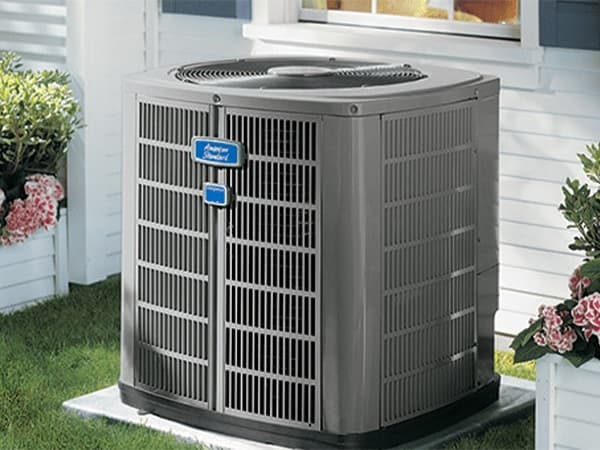 Air Conditioning System Installation in Tarrant County American Standard AC unit outside a residential home in the Mid-Cities of North Texas