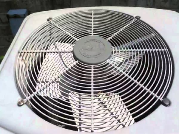 Understanding Air Conditioning Systems Top view of an outdoor air conditioning unit fan and grille