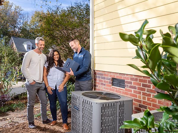 Air Conditioning and Heating Repair Service Technician repairing residential HVAC system components